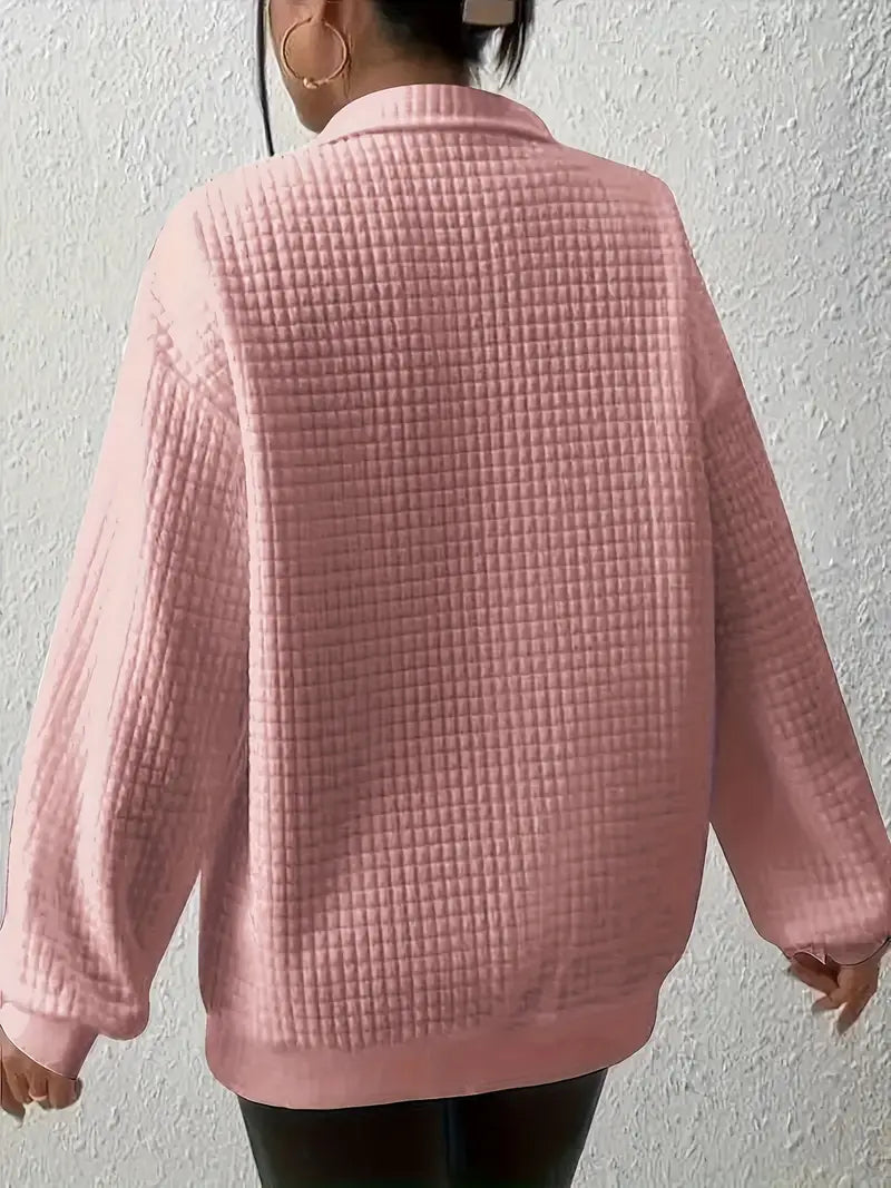 comfortabele en losse sweater met een effen glimlachende smiley